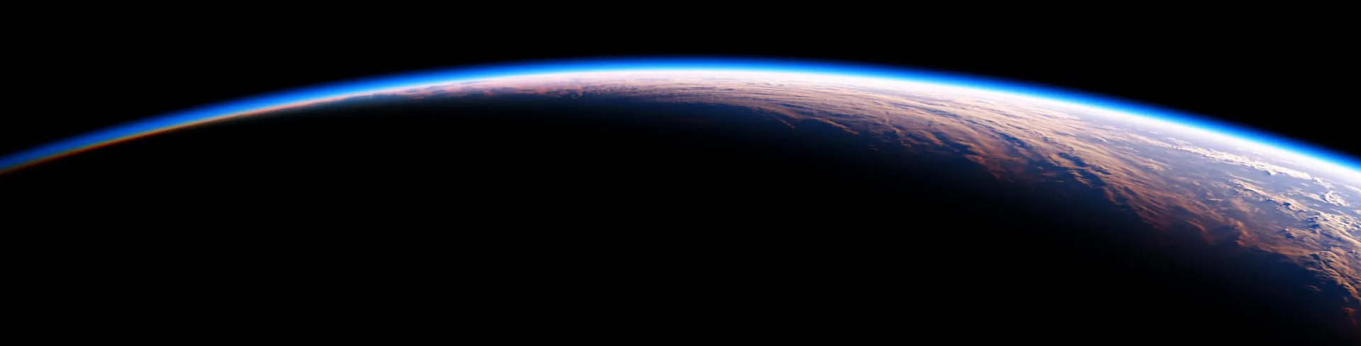 Vue panoramique de l'horizon terrestre depuis l'espace montrant la fine couche bleue de l'atmosphère au-dessus des nuages